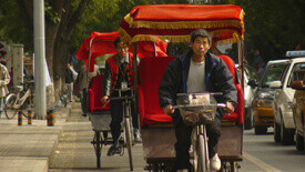 travelling by tuk tuk in Beijing